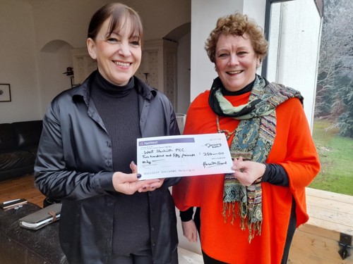 Hazel Brand presenting cheque to lady from West Stockwith PCC